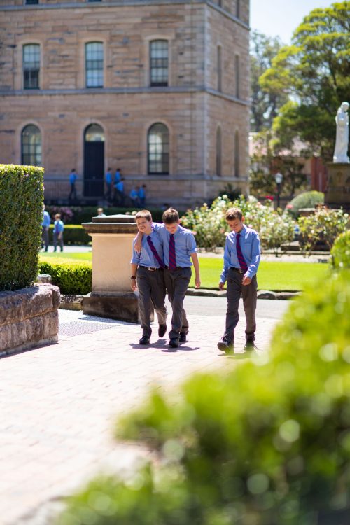 boys walking on College grounds